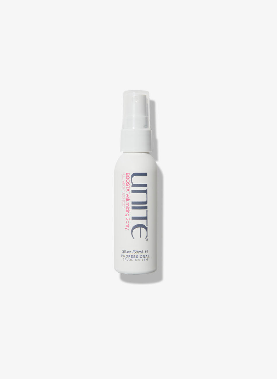 Travel-size bottle of volumizing spray for professional salon hair styling.