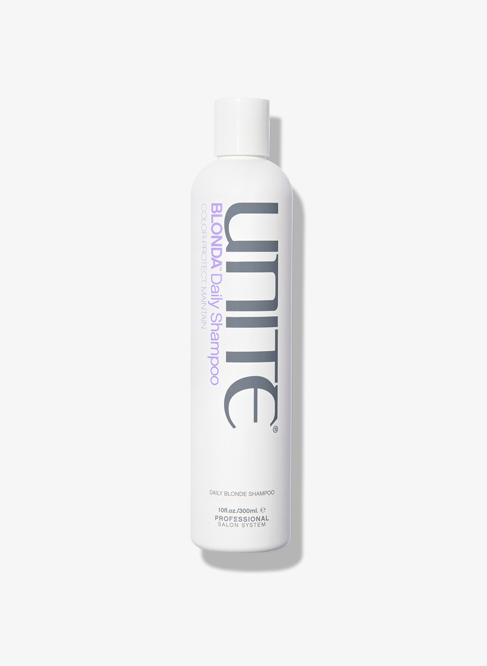 White bottle of UNITE Hair BLONDA Daily Shampoo, 10 oz, professional salon system product for daily blonde hair care.