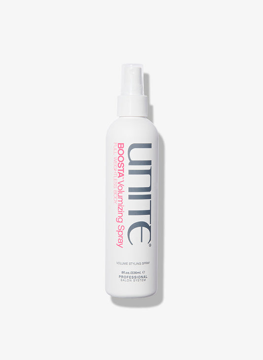 Bottle of volumizing spray for professional salon hair styling.